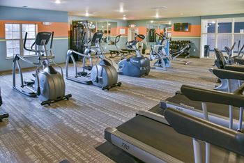 Cardio and strength training equipment in the fitness center at Cardinal Point.